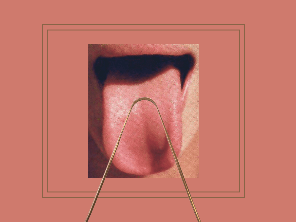 Close-up of tongue scraping with a copper tool—an ancient Ayurvedic ritual that supports breath, digestion, and daily detoxification.